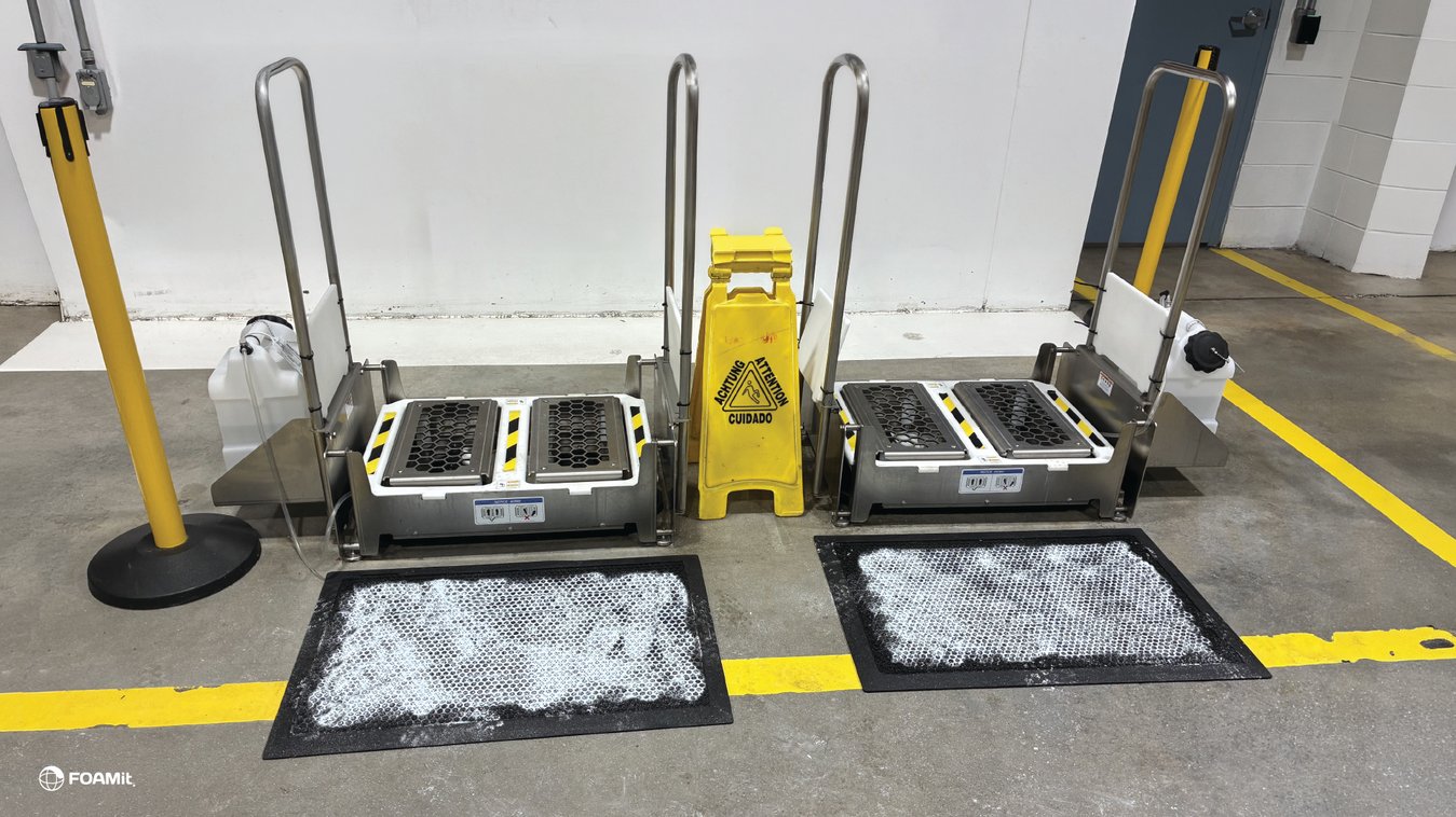 two airless footwear sanitation units paired with dry powder mats in a facility