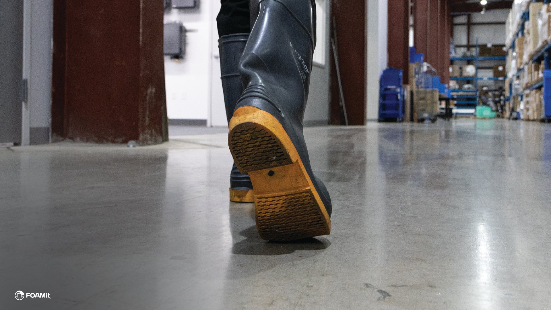 Person walking with boots through a facility