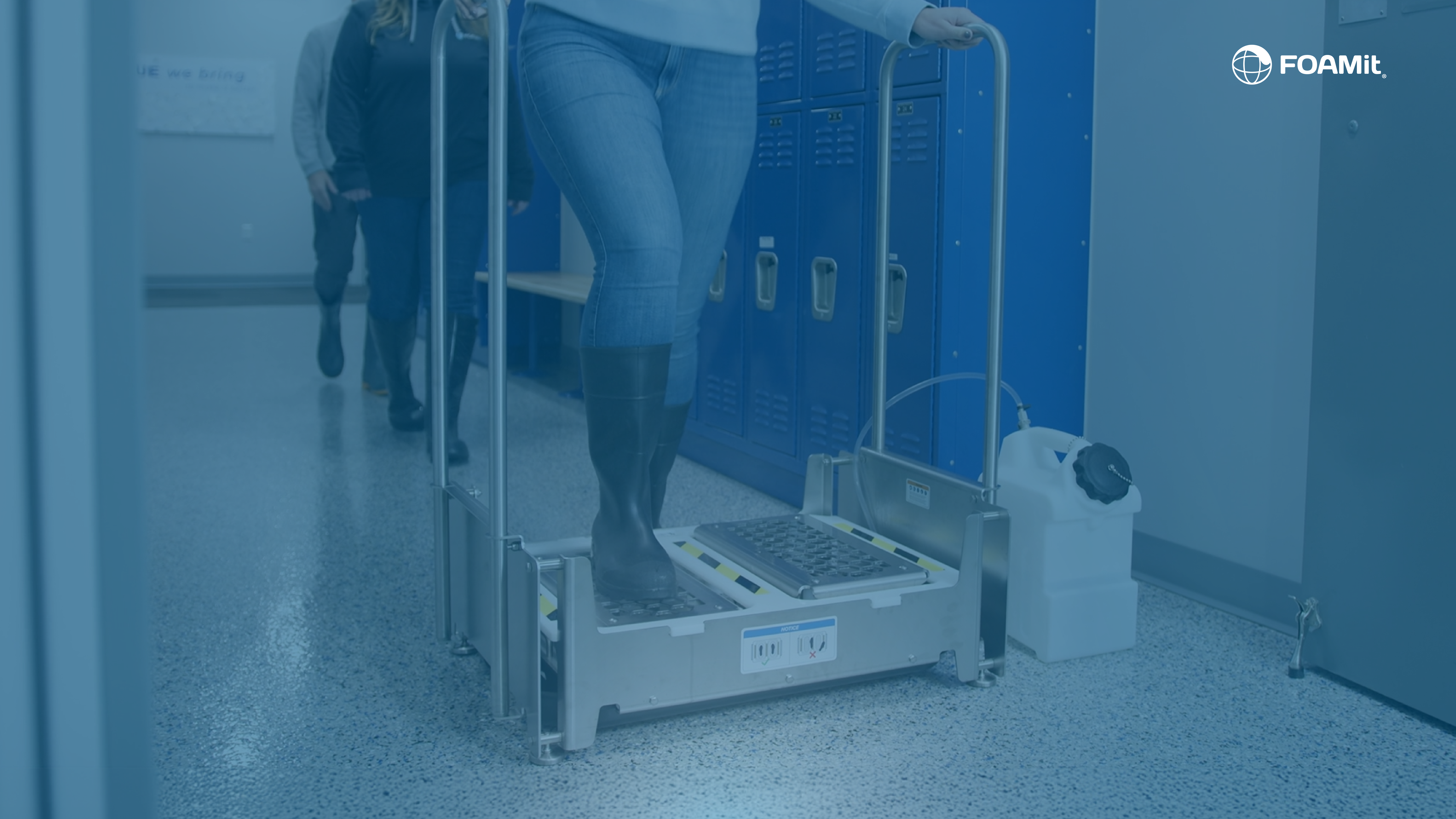 People walking through footwear sanitiation system